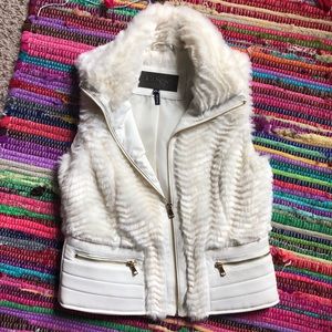 White/cream faux furry vest.